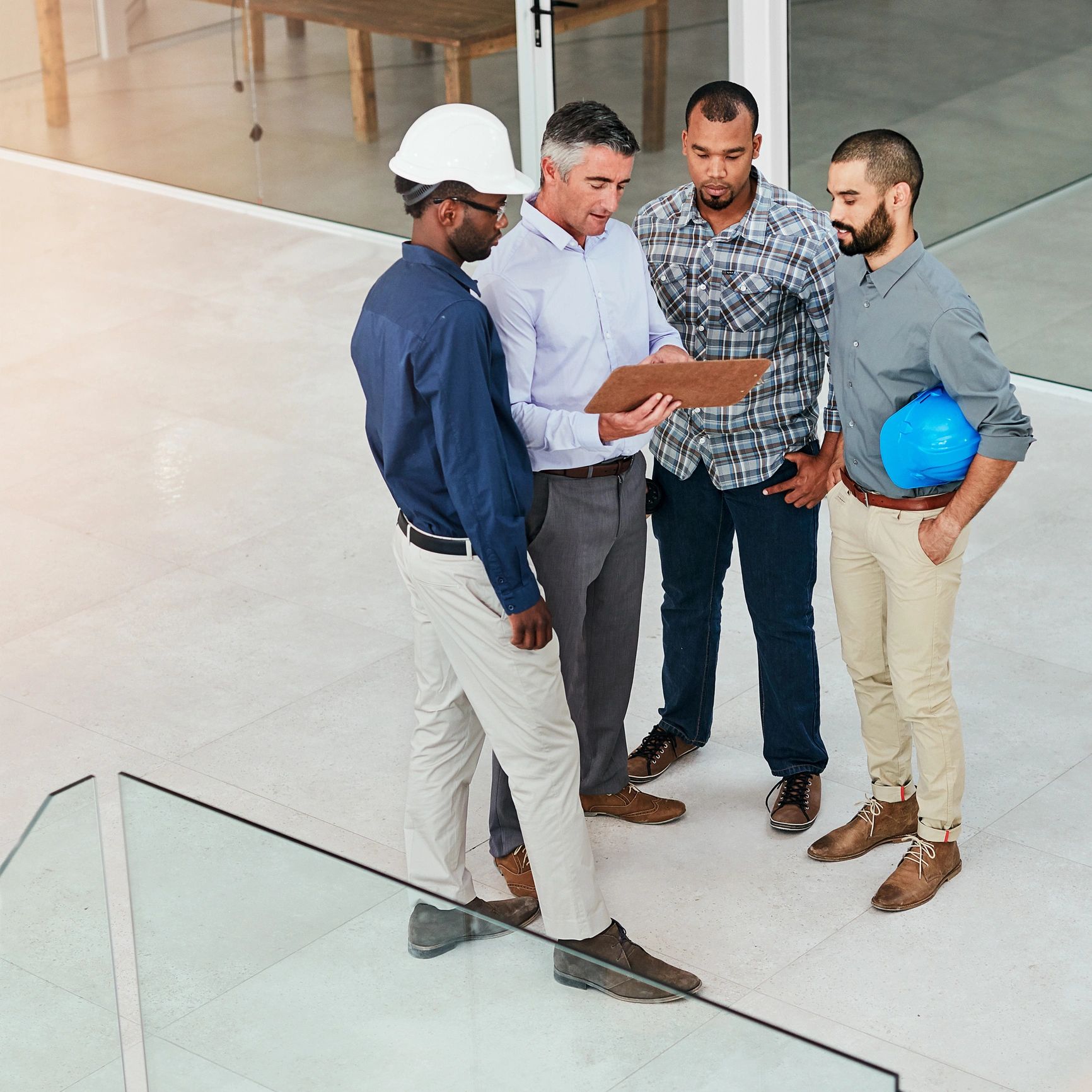 Construction professionals reviewing plans on a jobsite